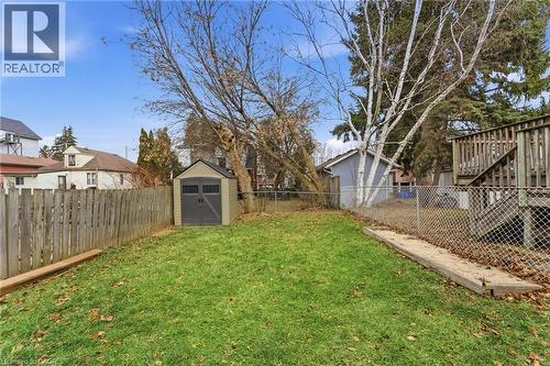 Fenced backyard featuring a shed and a residential view - 140 Royal Avenue, Hamilton, ON - Outdoor