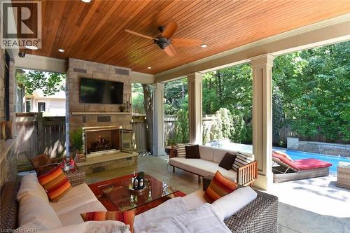 Walk out to the Covered Patio & Pool! Great Flow for Entertaining! - 4180 Lakeshore Road, Burlington, ON - Outdoor With Deck Patio Veranda With Exterior