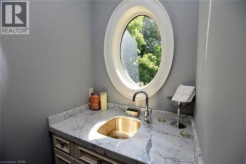 Sink in the Large Walk In Closet - 4180 Lakeshore Road, Burlington, ON - Indoor Photo Showing Bathroom