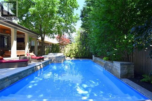 Tranquil Waterfall - 4180 Lakeshore Road, Burlington, ON - Outdoor With In Ground Pool With Backyard
