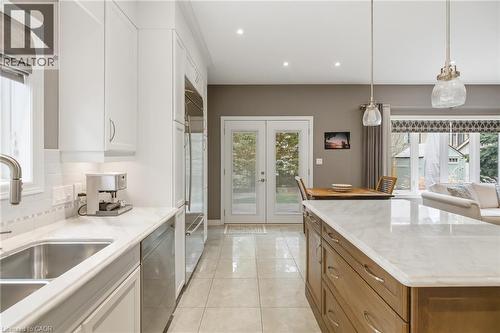 Direct Walk-out to outdoor patio, kitchen - 21 Tulip Tree Road, Niagara-On-The-Lake, ON - Indoor Photo Showing Kitchen With Double Sink