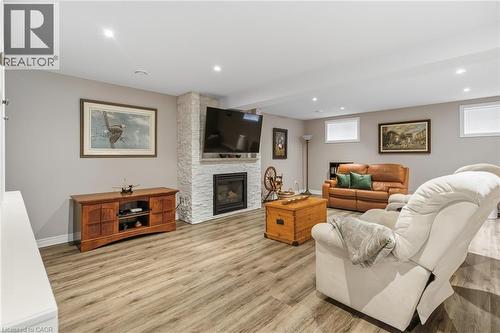 Gas fireplace with custom surround - 21 Tulip Tree Road, Niagara-On-The-Lake, ON - Indoor With Fireplace