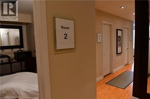Hallway featuring light wood-type flooring and recessed lighting - 265 Queen Street S, Mississauga, ON 