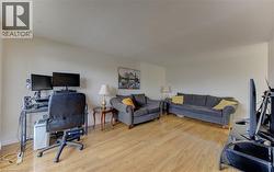 Office with light wood finished floors and a textured ceiling - 