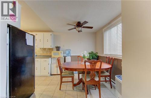 Dining room featuring a ceiling fan and light tile patterned flooring - 4 Avalon Place Unit# 103, Kitchener, ON - Indoor Photo Showing Dining Room