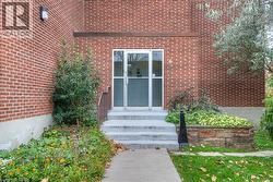 Property entrance with brick siding - 