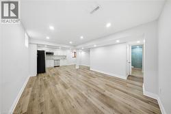 Unfurnished living room with recessed lighting and light wood-type flooring - 