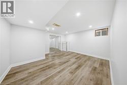 Finished basement featuring recessed lighting and light wood-style floors - 