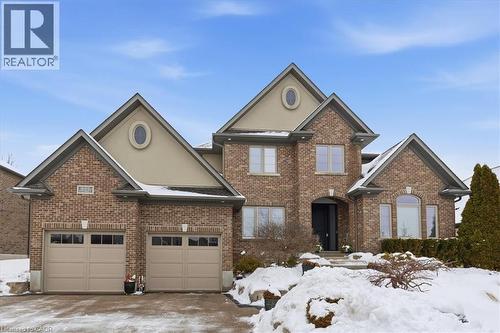 View of front of home featuring brick siding, stucco siding, and driveway - 237 River Birch Street, Kitchener, ON - Outdoor With Facade