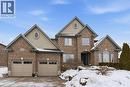 View of front of home featuring brick siding, stucco siding, and driveway - 237 River Birch Street, Kitchener, ON  - Outdoor With Facade 