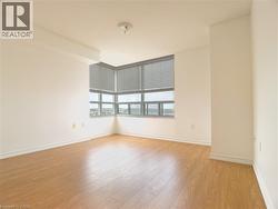 Empty room featuring light wood-type flooring and baseboards - 