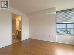 Spare room with light wood-style flooring and baseboards - 