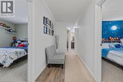 Corridor with ornamental molding, wood finished floors, and carpet floors - 