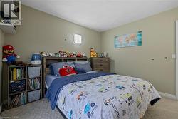 Bedroom featuring light carpet and baseboards - 