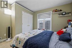 Bedroom featuring carpet and a closet - 
