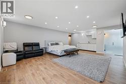 Bedroom with recessed lighting and light wood finished floors - 