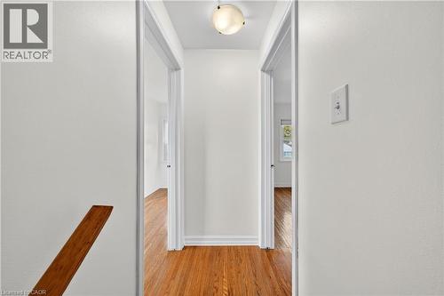 Hallway with light wood-type flooring and baseboards - 421 East 36Th Street, Hamilton, ON - Indoor Photo Showing Other Room