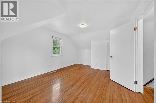 Additional living space featuring light wood finished floors and lofted ceiling - 421 East 36Th Street, Hamilton, ON - Indoor Photo Showing Other Room