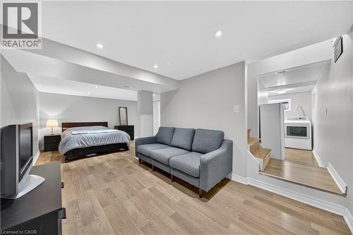 Bedroom with washer / clothes dryer, light wood-type flooring, and recessed lighting - 421 East 36Th Street, Hamilton, ON - Indoor