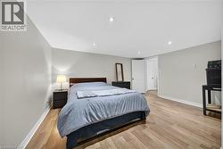 Bedroom featuring light wood finished floors and recessed lighting - 
