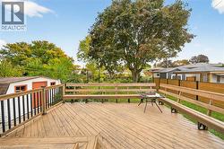 Deck featuring an outdoor structure - 