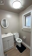 Half bathroom featuring vanity and light wood-type flooring - 