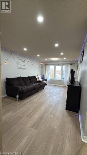 Living area featuring light wood-style flooring and recessed lighting - 419 Downsview Place, Waterloo, ON - Indoor