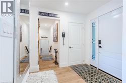 Foyer with light wood-type flooring and recessed lighting - 