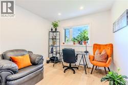 Office space featuring wood-type flooring and recessed lighting - 