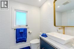 Bathroom with toilet and vanity - 