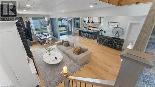 virtually staged - 33 Cedar Drive, Turkey Point, ON - Indoor With Fireplace