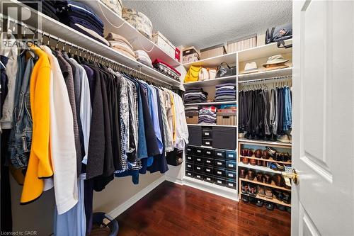 Spacious closet featuring dark wood-style floors - 4165 Stonebridge Crescent, Burlington, ON - Indoor With Storage