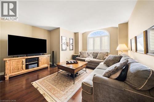 Living room with dark wood-style floors and baseboards - 4165 Stonebridge Crescent, Burlington, ON - Indoor Photo Showing Living Room