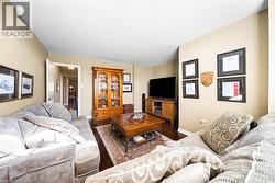 Living area featuring wood finished floors and baseboards - 