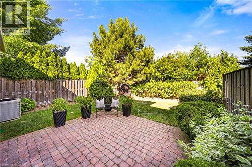 Fenced backyard with a patio area - 4165 Stonebridge Crescent, Burlington, ON - Outdoor