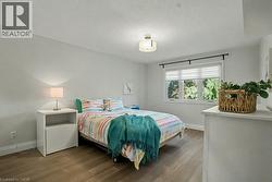 Bedroom with wood finished floors - 