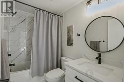Bathroom featuring vanity and shower / tub combo - 