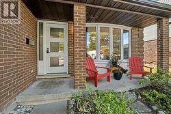 View of exterior entry with brick siding - 