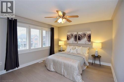Bedroom featuring light wood-style floors and ceiling fan - 5109 Blue Spruce Avenue, Burlington, ON - Indoor Photo Showing Bedroom