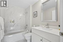 Bathroom is renovated with carara sparkling porcelain tile - 