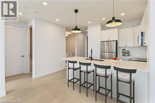 Virtually Staged - 101 Locke Street S Unit# 507, Hamilton, ON - Indoor Photo Showing Kitchen With Upgraded Kitchen