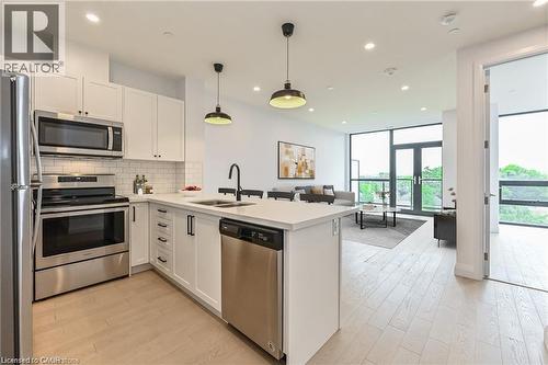 Virtually Staged - 101 Locke Street S Unit# 507, Hamilton, ON - Indoor Photo Showing Kitchen With Stainless Steel Kitchen With Double Sink With Upgraded Kitchen