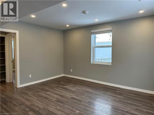 Spare room featuring dark wood-type flooring and recessed lighting - 80 Glen Road Unit# Upper, Kitchener, ON - Indoor Photo Showing Other Room