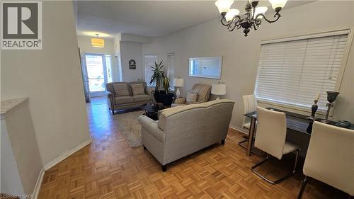 Living room with baseboards and a chandelier - 3688 Emery Drive, Mississauga, ON - Indoor