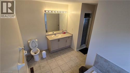Bathroom featuring vanity, light tile patterned flooring, and a stall shower - 3688 Emery Drive, Mississauga, ON - Indoor Photo Showing Bathroom
