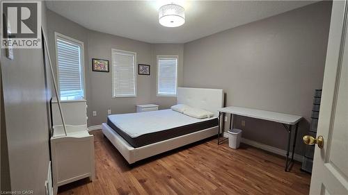 Bedroom featuring wood finished floors and a textured ceiling - 3688 Emery Drive, Mississauga, ON - Indoor Photo Showing Bedroom