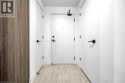 Hall featuring light wood-type flooring - 