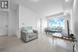 Living area featuring wood finish floors and baseboards - 