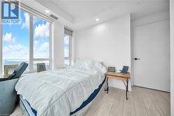 Bedroom featuring light wood-style flooring and recessed lighting - 