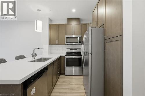 101 Locke Street S Unit# 309, Hamilton, ON - Indoor Photo Showing Kitchen With Double Sink With Upgraded Kitchen